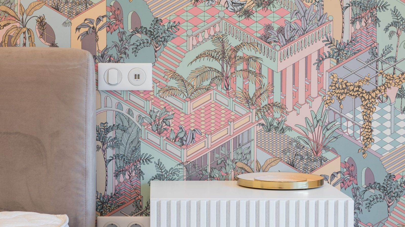 A bedroom wall covered in a pastel architectural peel-and-stick mural