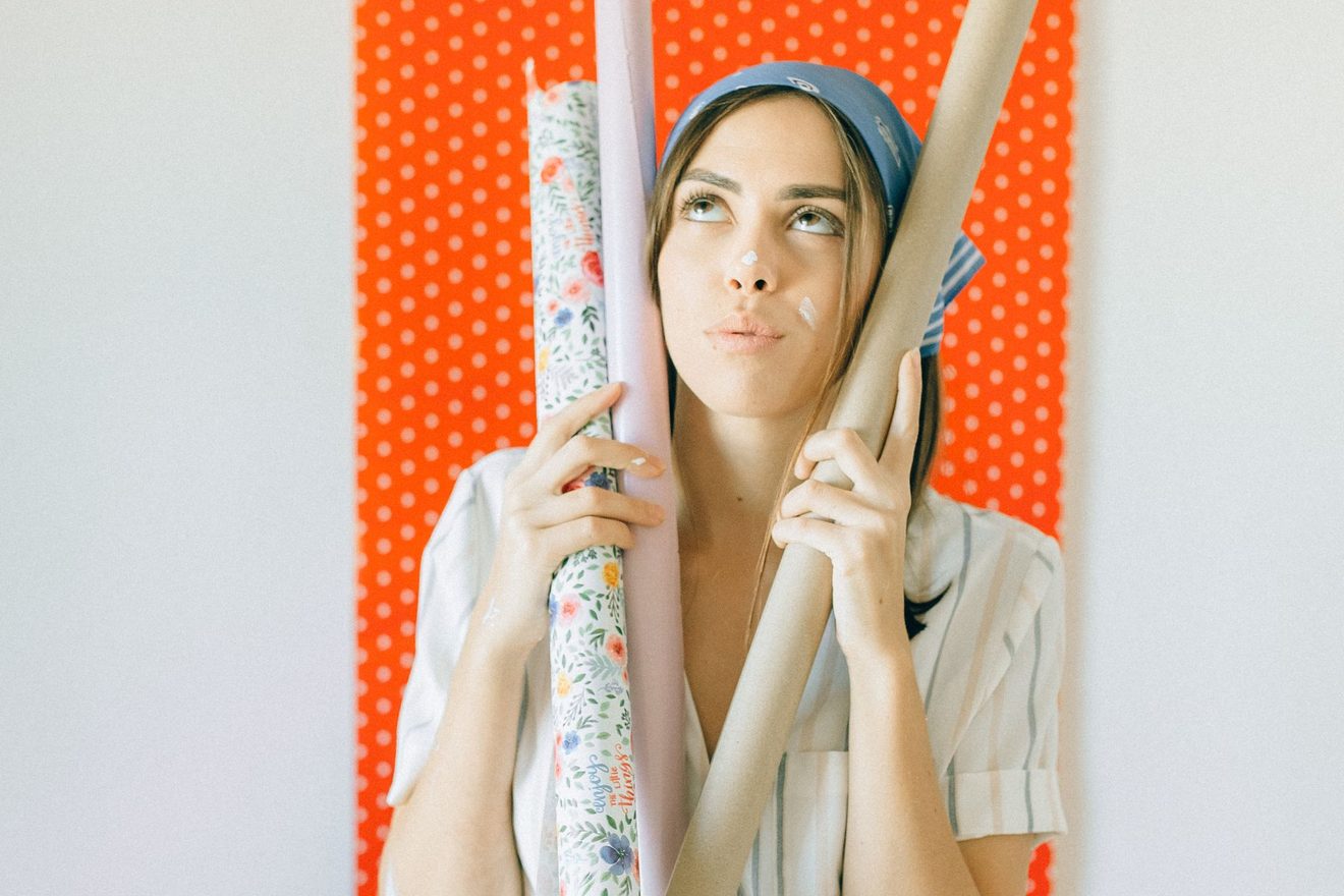Rolls of patterned wallpaper held together